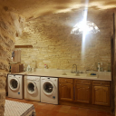 Laundry room with three washing machines